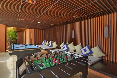Have fun with a game of foosball while the kids enjoy the pool