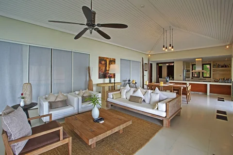 Open plan lounge, dining, and kitchen area with modern design